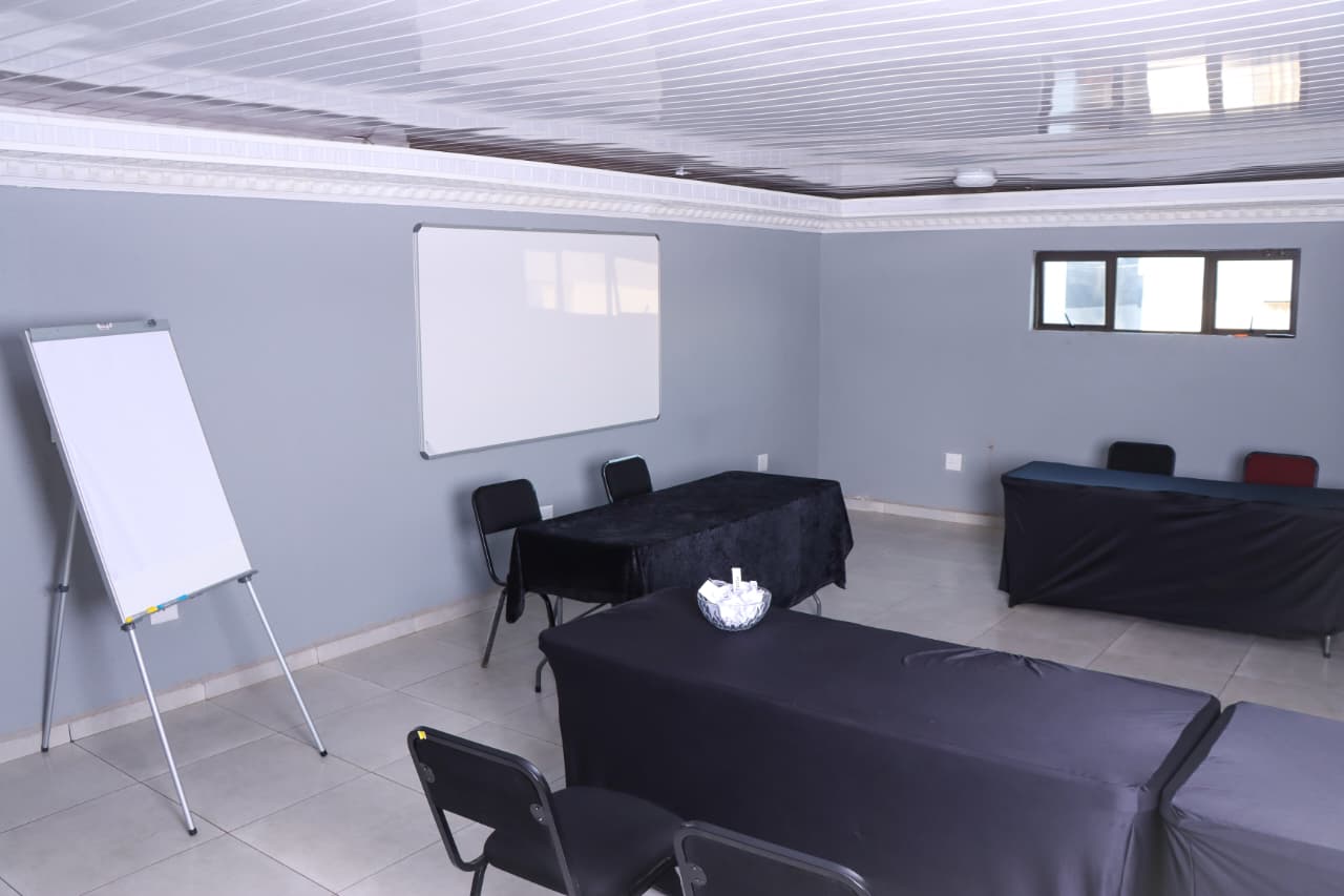 Conference room with whiteboard and flip chart
