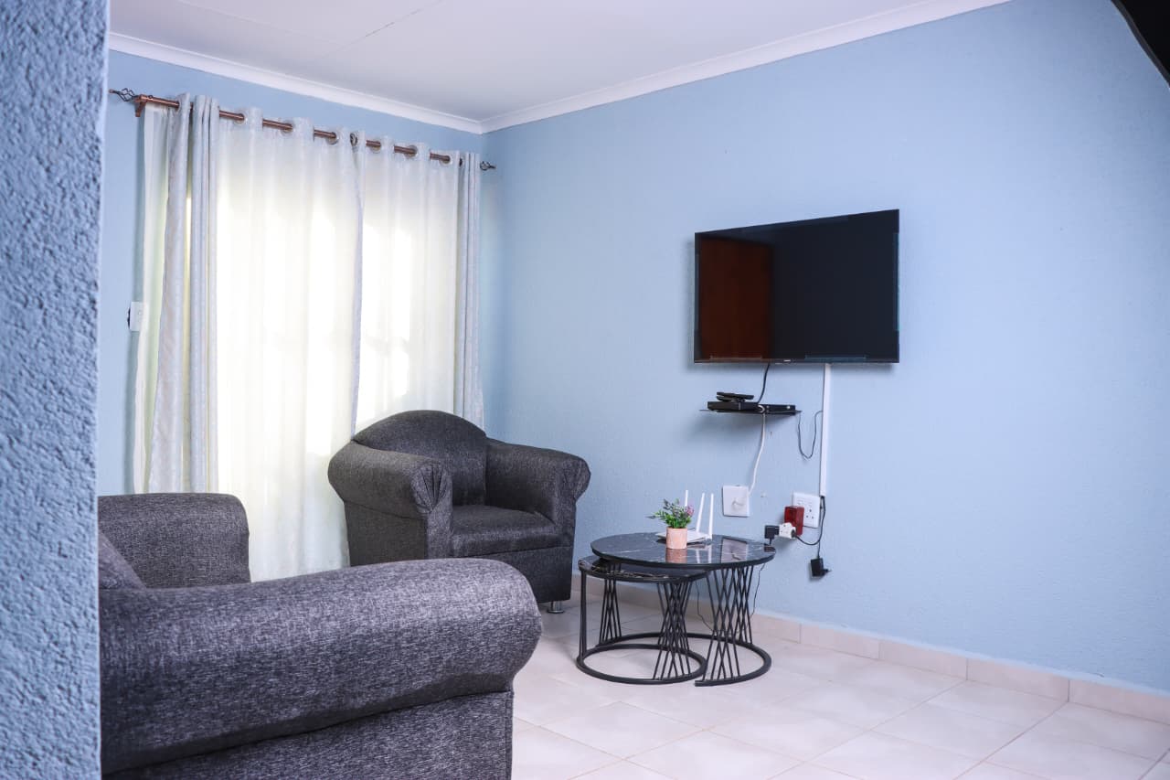 Self-catering lounge with sofas and TV